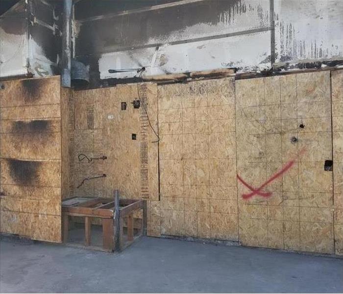 garage boarded up after wild fire 